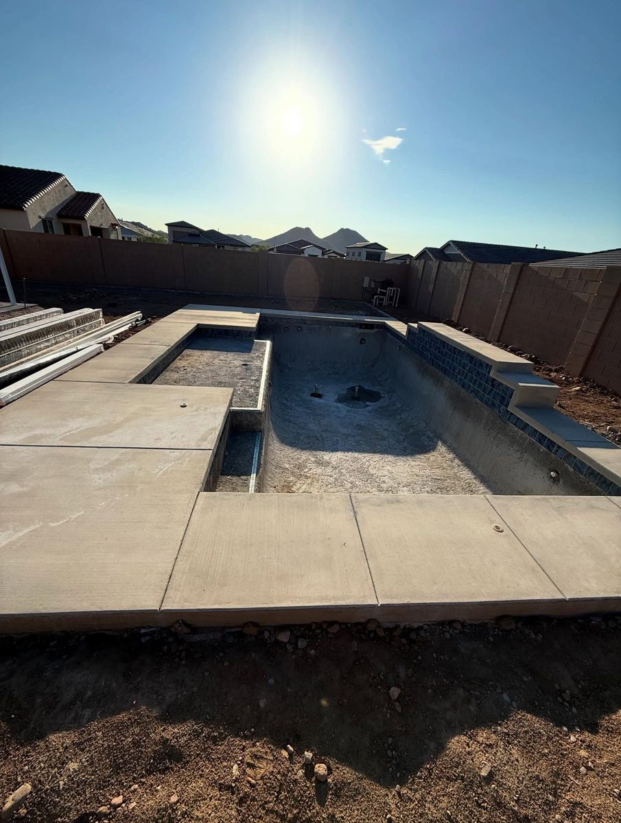 New pool with bare concrete deck