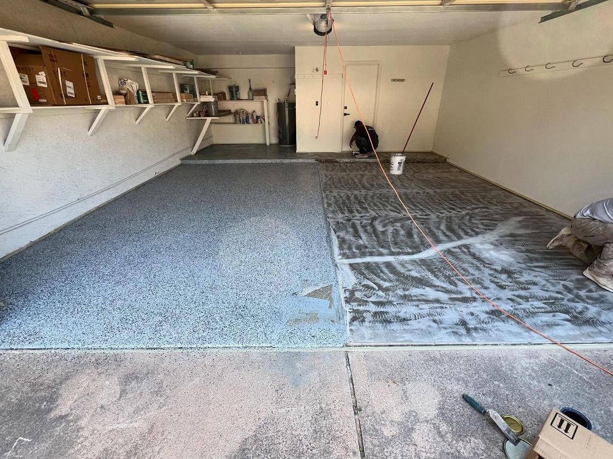 Garage floor half covered in flake epoxy