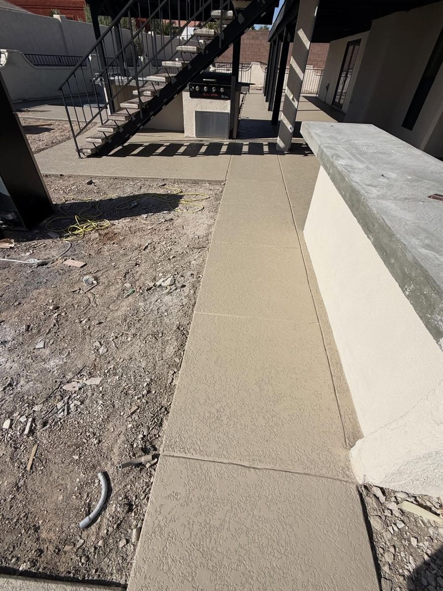 Walkway beside an outdoor kitchen before the final finish
