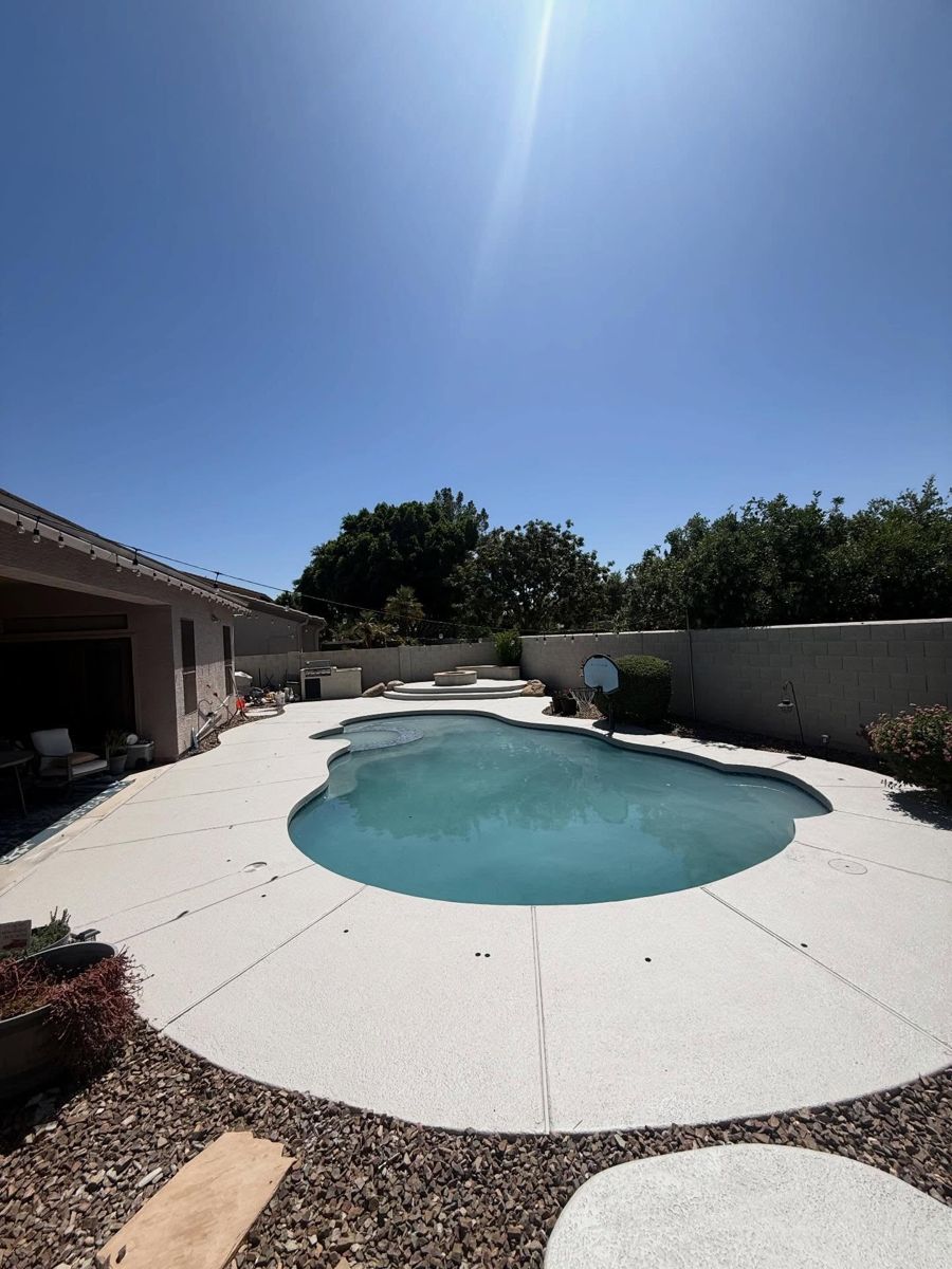 Same pool deck finished in white with a fire pit